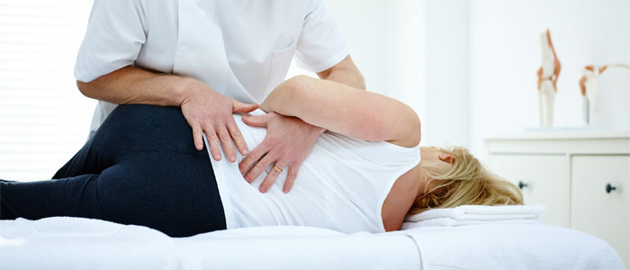 chiropractor performing an adjustment